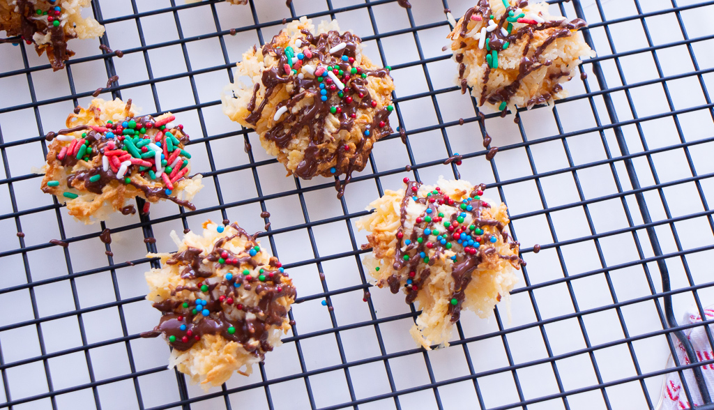 While the chocolate is still wet, add some sprinkles. This was Jazzy's favourite part of this recipe! She went wild lol. Enjoy your festive coconut macaroons!