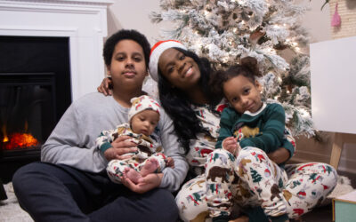 Black mom and kids wearing matching pjs